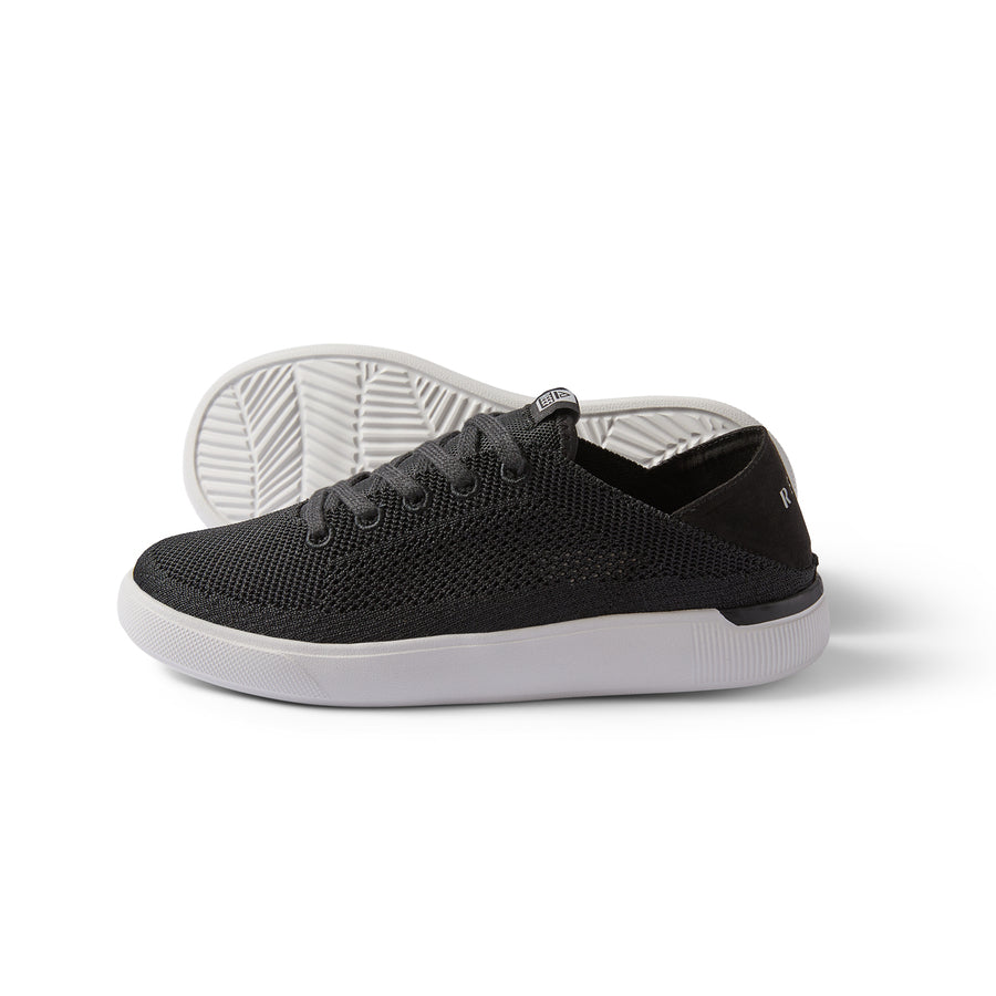 Black Reef Kids Neptune sneakers with white sole on clean background