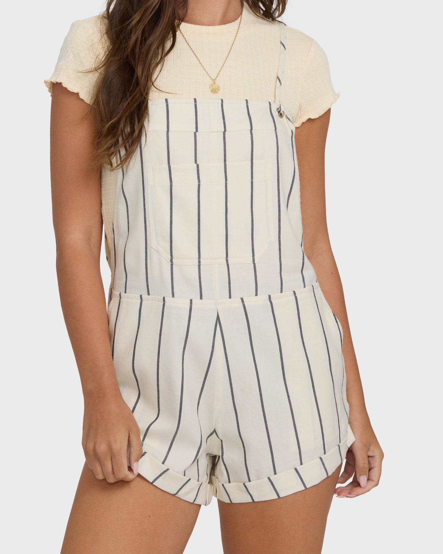 Billabong Wild Pursuit Overall YD in white cap striped shortall worn over cream tee