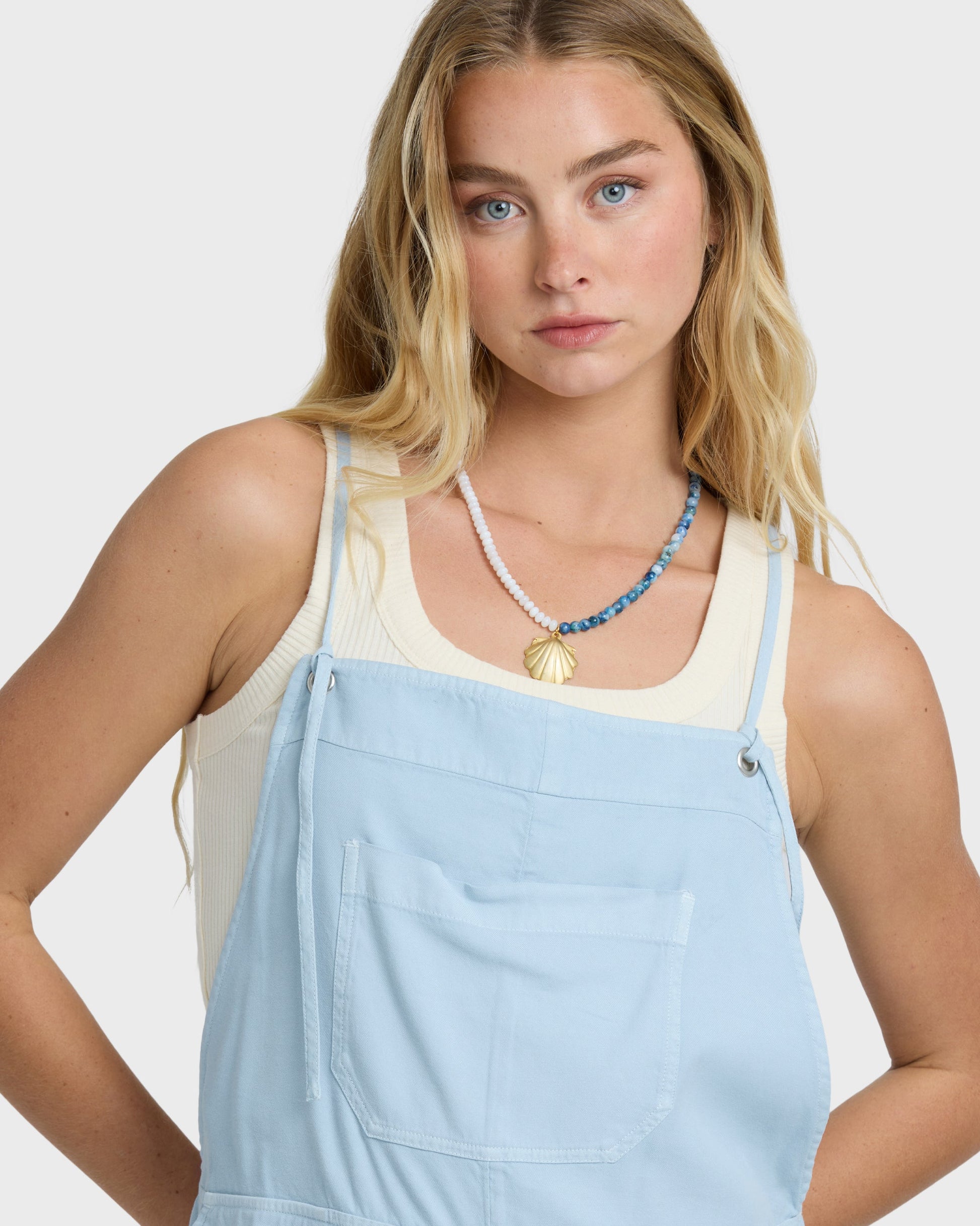 Billabong Wild Pursuit Overall Solid in washed chambray worn by blonde female model