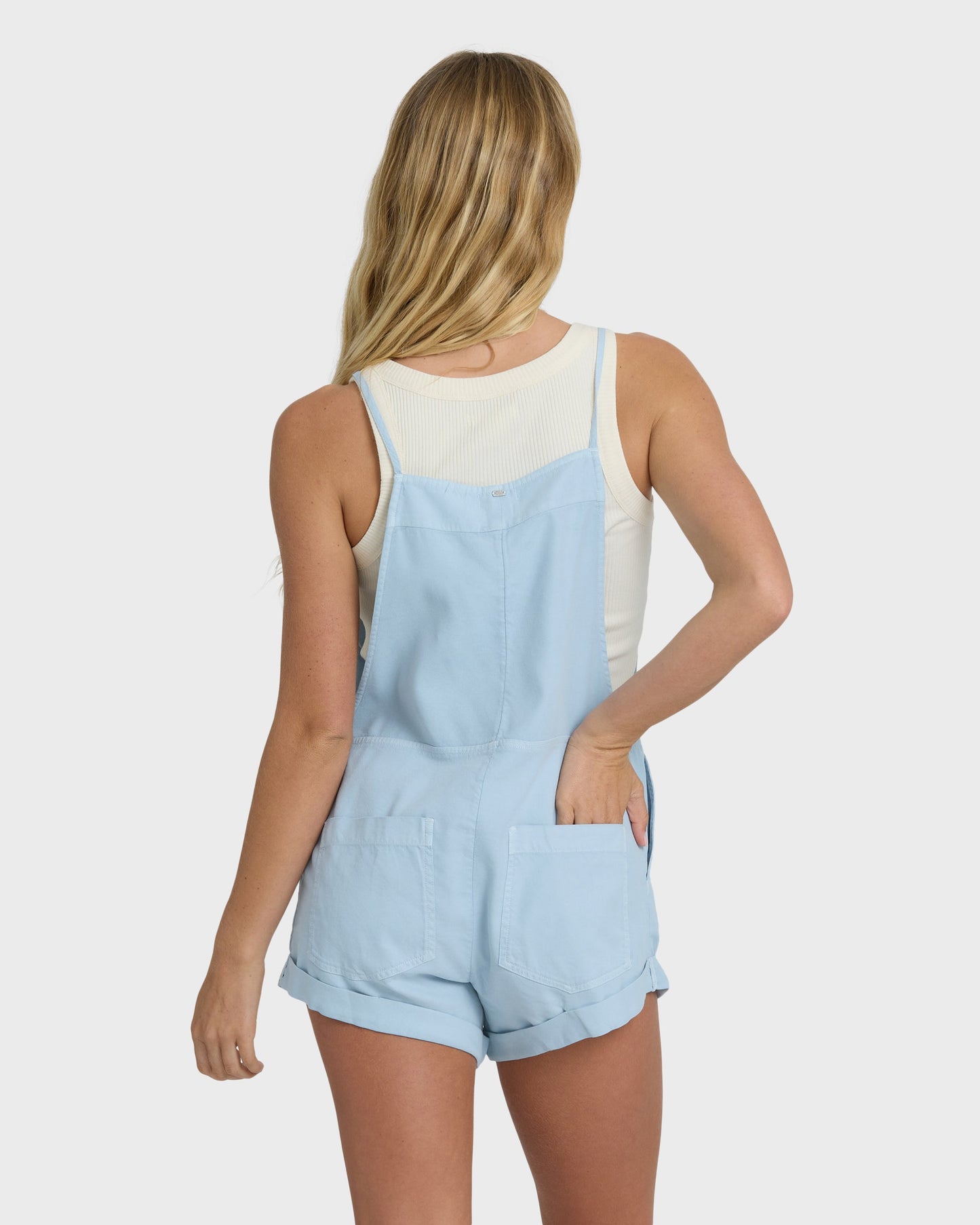 Billabong Wild Pursuit Overall Solid in washed chambray blue, back view on model