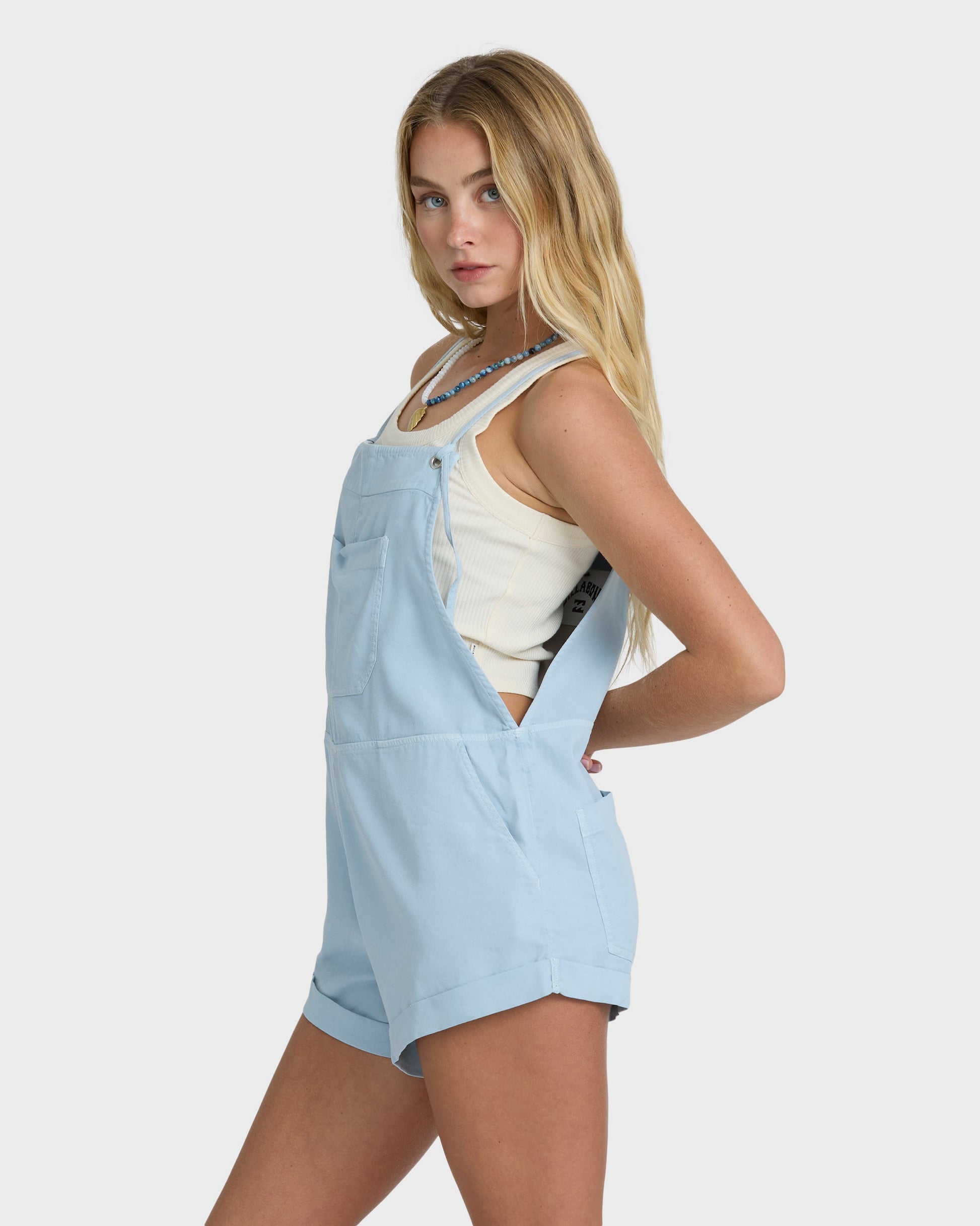 Billabong Wild Pursuit Overall Solid in Washed Chambray light blue on blonde model