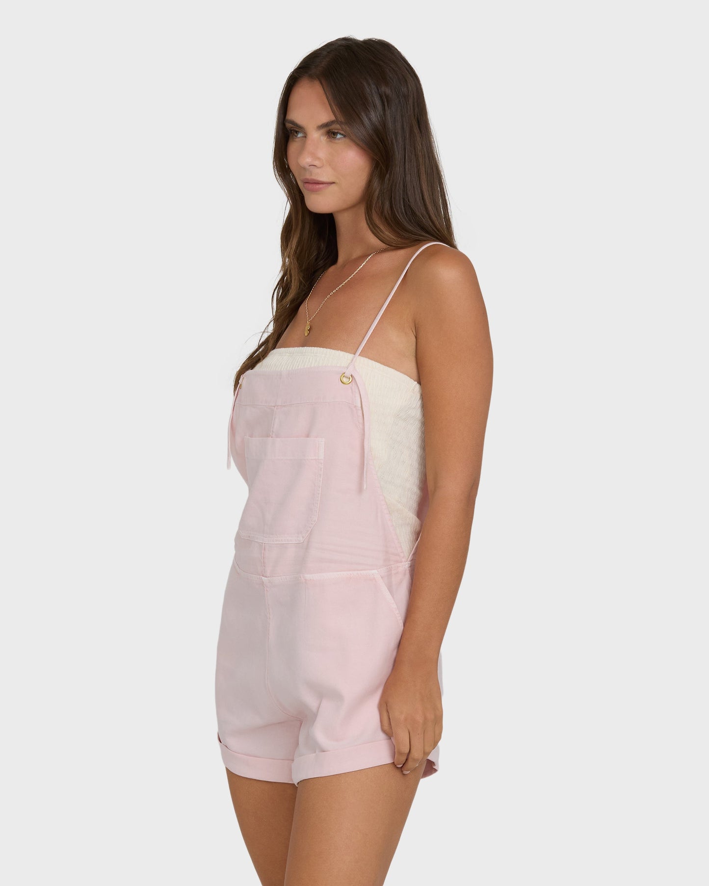 Billabong Wild Pursuit Overall Solid in Rosewater pink, worn by brunette model on white background