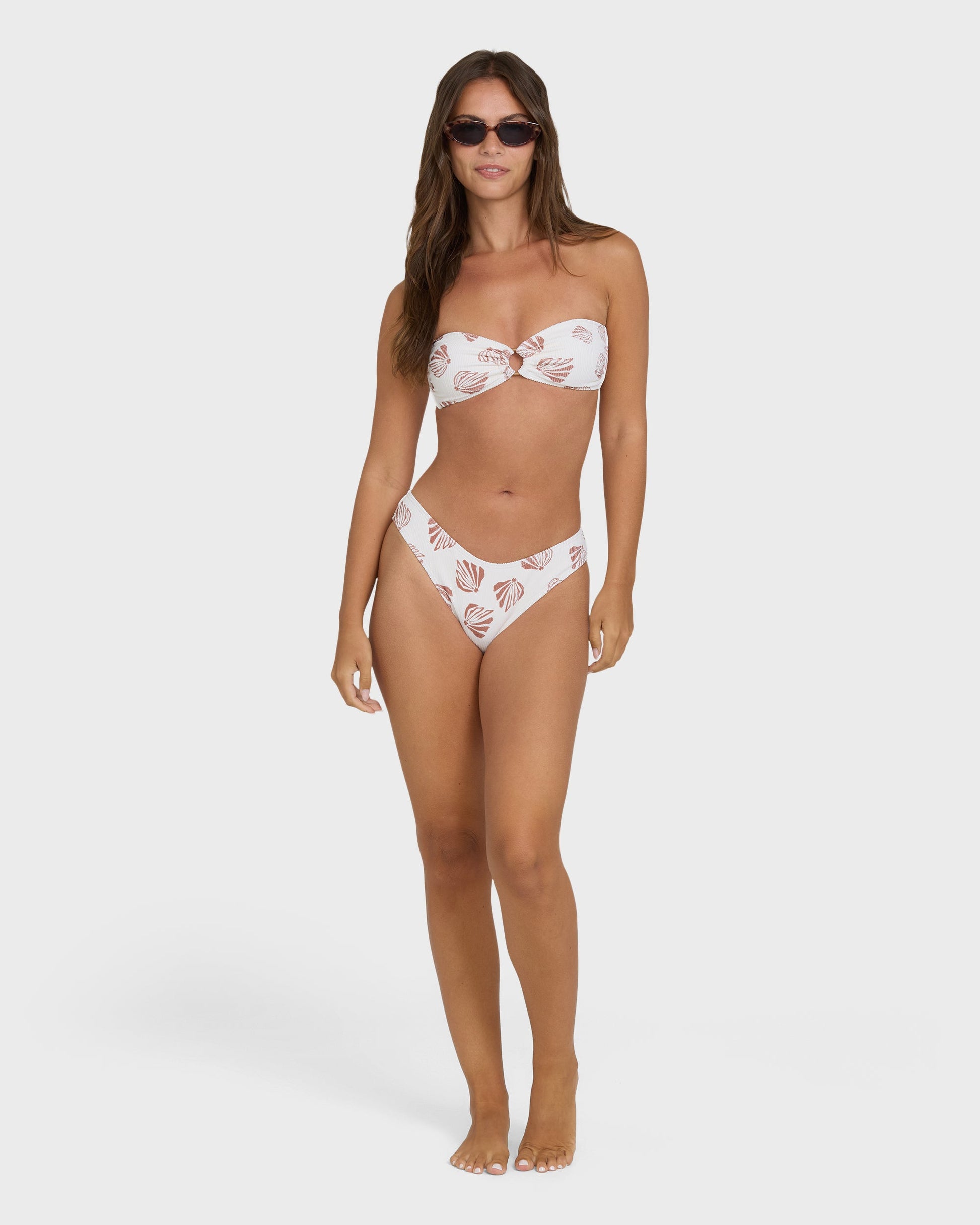 Billabong Sandy Shells Rio Bandeau bikini set in Salt Crystal white shell print on model