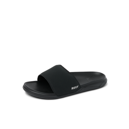 Black Reef Men's Tailslide sandal with textured footbed on white background