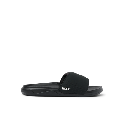 Reef Men's Tailslide black slide sandal with white logo on clean background