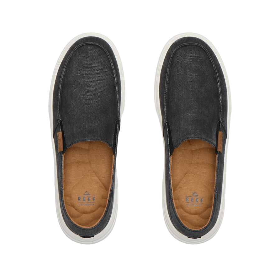 Reef Swellsole Pacific black canvas slip-on shoes with tan insoles on white background