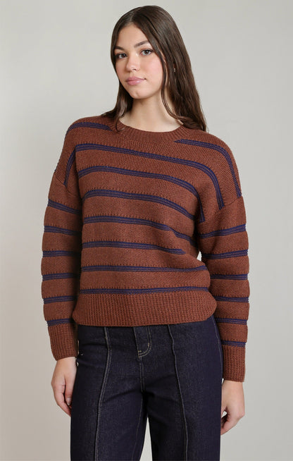 Dex stripe crewneck sweater in rusty brown with navy blue stripes, paired with dark jeans