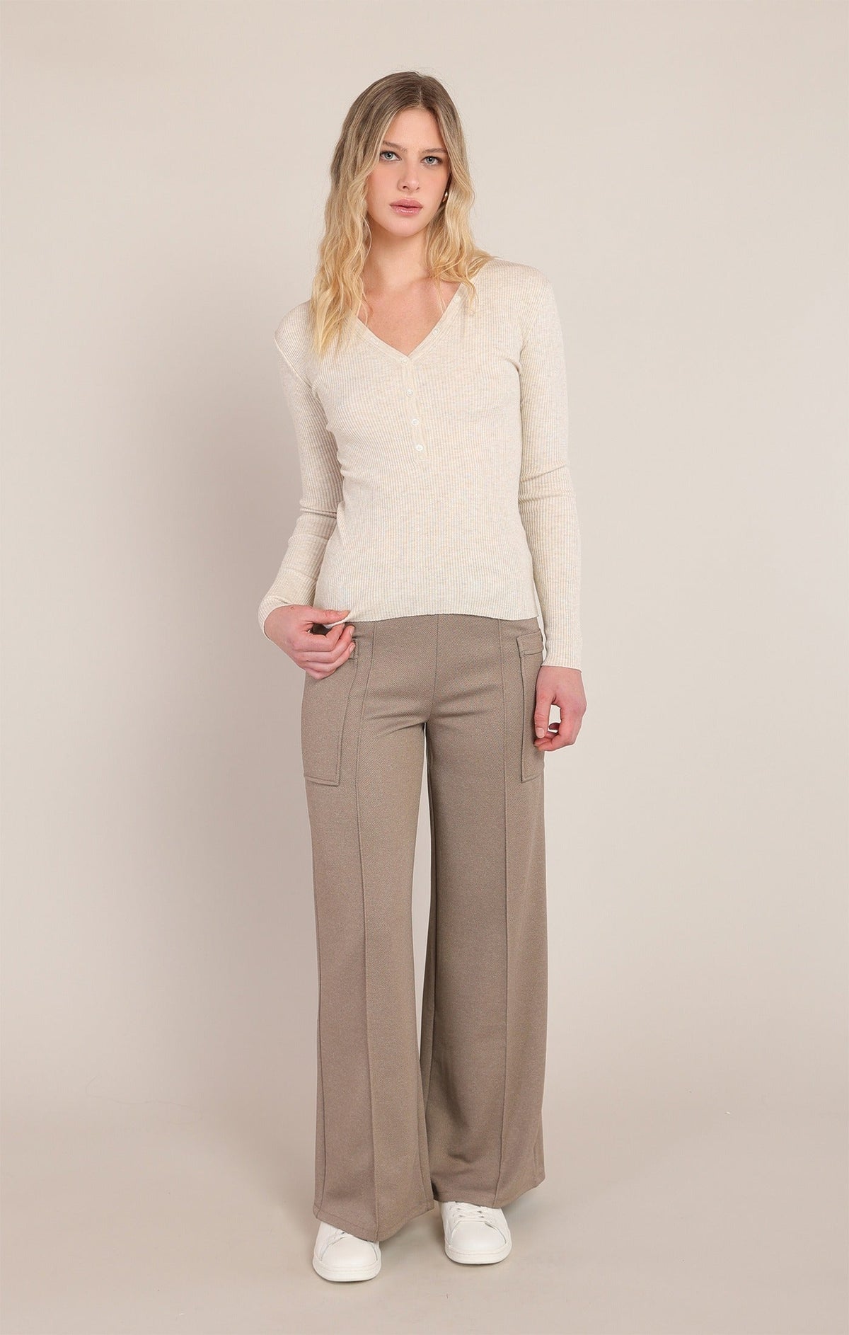 Dex ribbed cream heather V-neck sweater top with button detail, styled with wide-leg pants