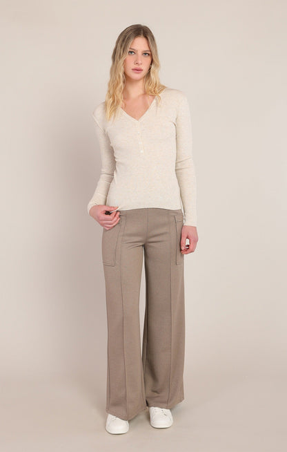 Dex ribbed cream heather V-neck sweater top with button detail, styled with wide-leg pants