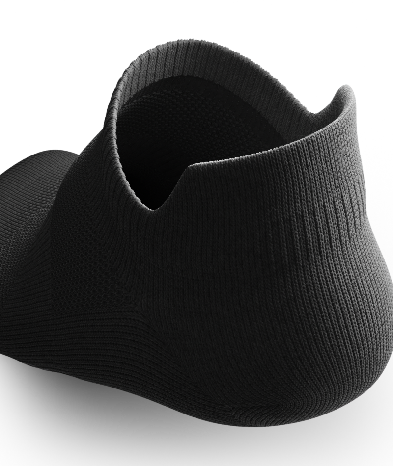 Outway Flagship Ankle Sock in solid black, shown from rear angle on white background