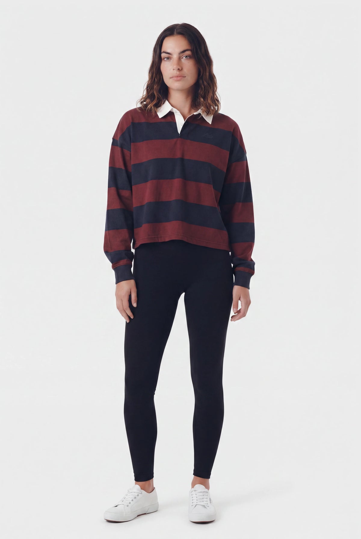 TeamLTD Heritage Rugby Polo in Deep Merlot and navy stripes with white collar, worn with black leggings