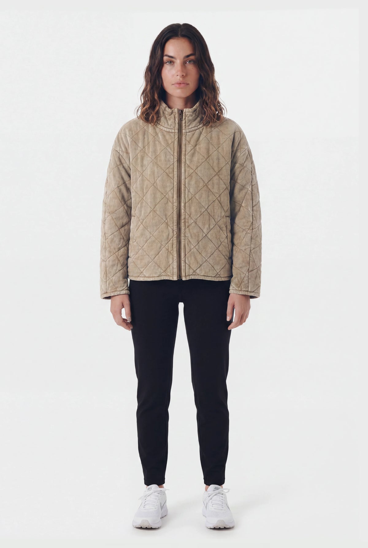 TeamLTD Northway Quilted Jacket in Washed Khaki worn by female model with black pants