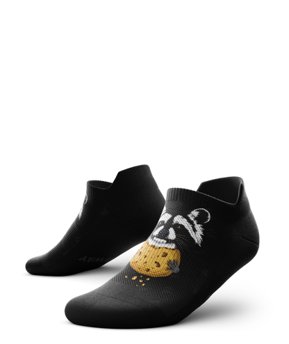 Outway Rad Raccoon black ankle socks featuring illustrated raccoon holding a cookie graphic