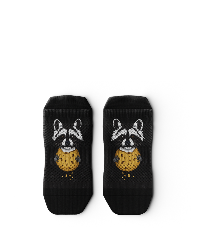 Outway Rad Raccoon black ankle socks featuring raccoon holding a chocolate chip cookie graphic
