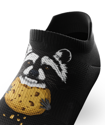 Outway Rad Raccoon black ankle sock featuring a raccoon holding a chocolate chip cookie graphic