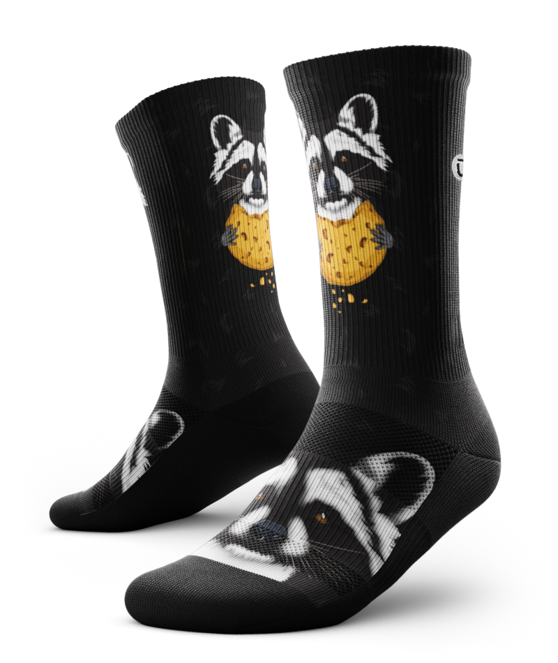 Outway Rad Raccoon Crew Socks in black featuring cartoon raccoon holding a cookie graphic