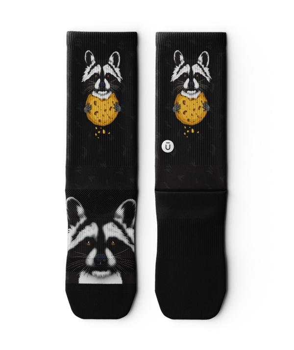 Outway Rad Raccoon black crew socks featuring raccoon holding chocolate chip cookie graphic