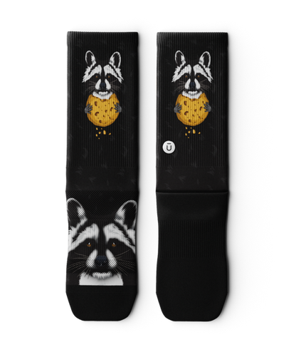 Outway Rad Raccoon black crew socks featuring raccoon holding chocolate chip cookie graphic
