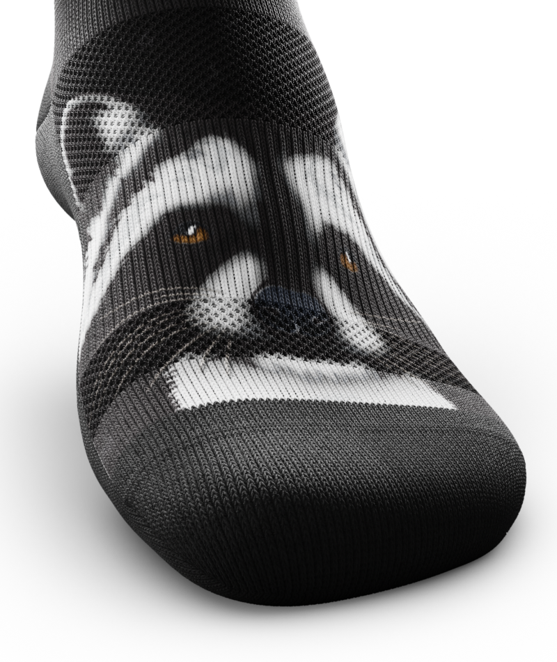 Outway Rad Raccoon low-cut sock featuring detailed black and white raccoon face print on dark background
