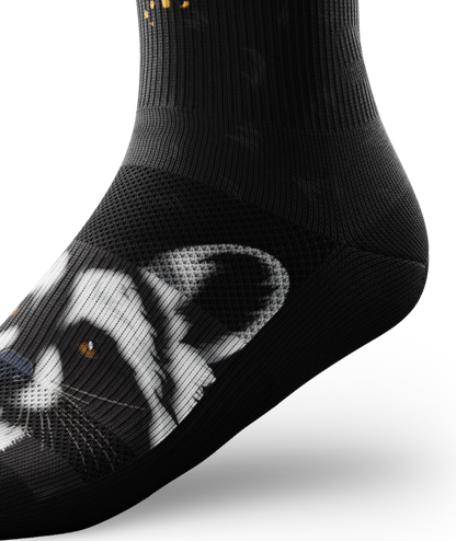 Outway Rad Raccoon Crew Sock in black with detailed raccoon face graphic on foot