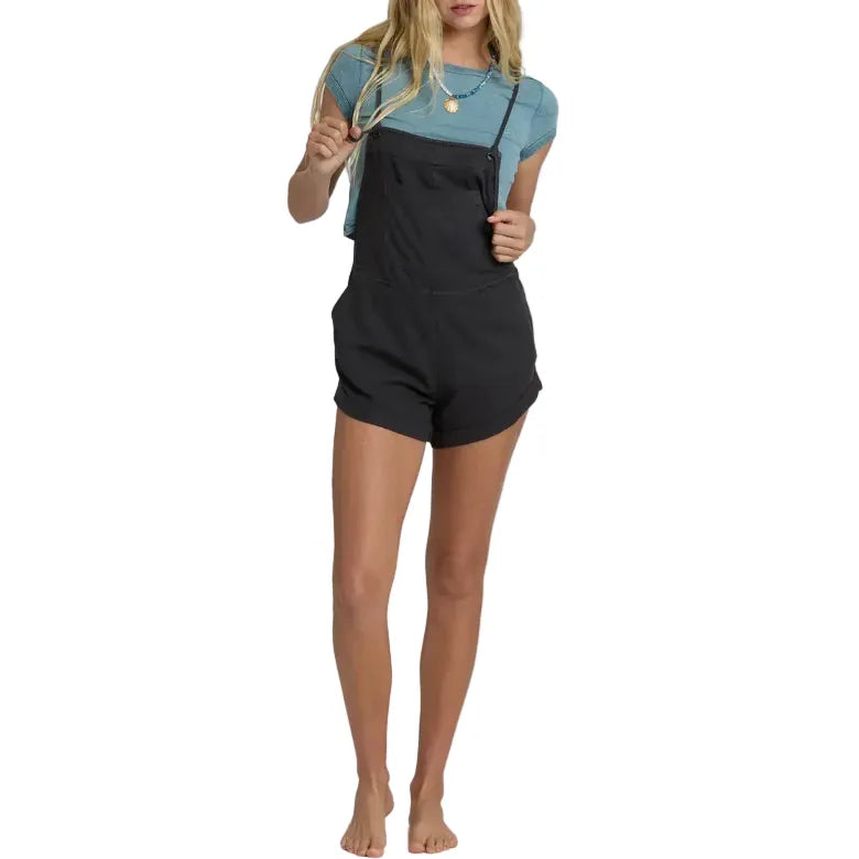 Billabong Wild Pursuit Overall Solid in Off Black worn over a teal t-shirt