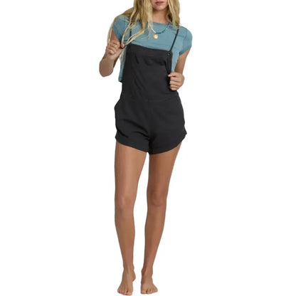 Billabong Wild Pursuit Overall Solid in Off Black worn over a teal t-shirt