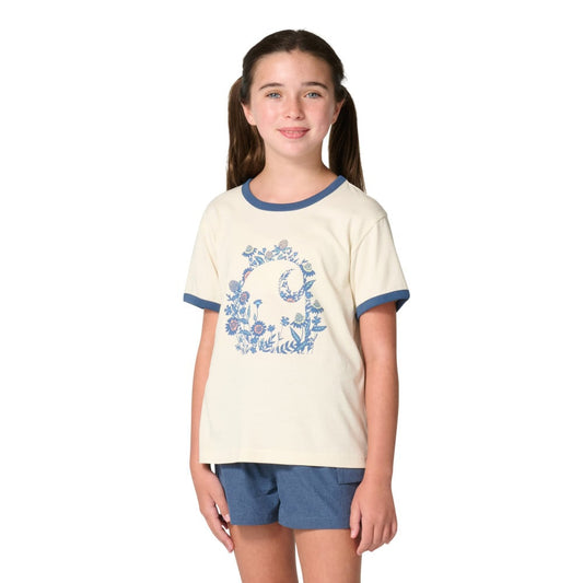 Girl wearing Carhartt Kids cream ringer tee with blue floral C graphic and denim shorts