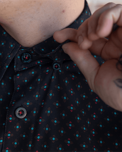 Dixxon High Desert Party Shirt close-up showing branded buttons and geometric pattern on black fabric